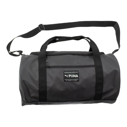 Brand Dealers Arena e.K. - BDA24 Puma Fit duffle bag in black polyester with shoulder strap and multiple compartments.