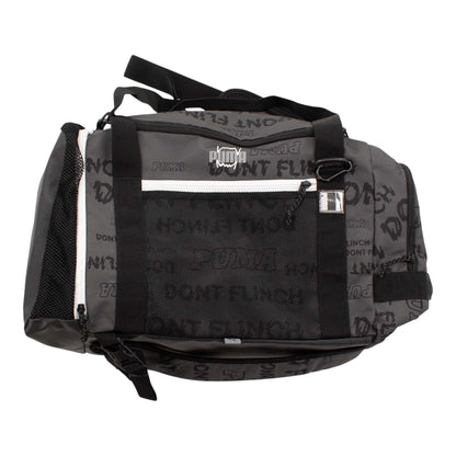 Brand Dealers Arena e.K. - BDA24 Puma basketball duffle bag in grey with all-over 'Puma Dont Flinch' print, mesh side pocket, and adjustable straps.
